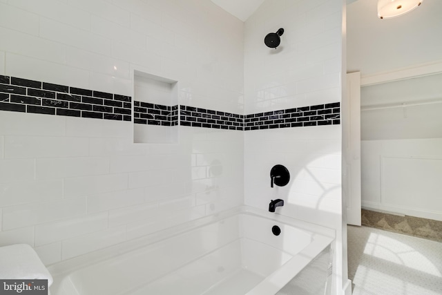 bathroom featuring washtub / shower combination