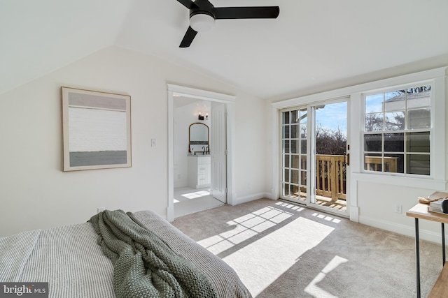 carpeted bedroom featuring access to exterior, connected bathroom, baseboards, lofted ceiling, and a ceiling fan