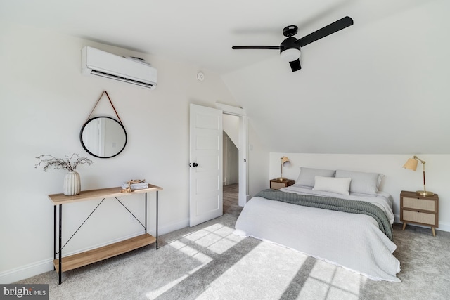 bedroom featuring baseboards, carpet floors, vaulted ceiling, and a wall unit AC