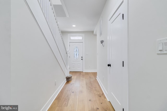 interior space with recessed lighting, baseboards, and light wood finished floors