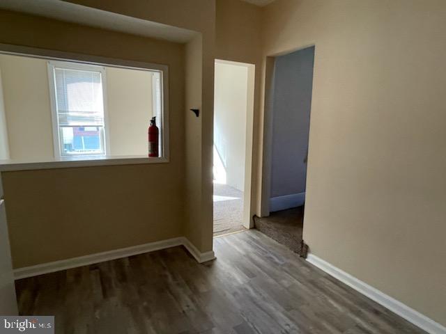 interior space with dark hardwood / wood-style flooring