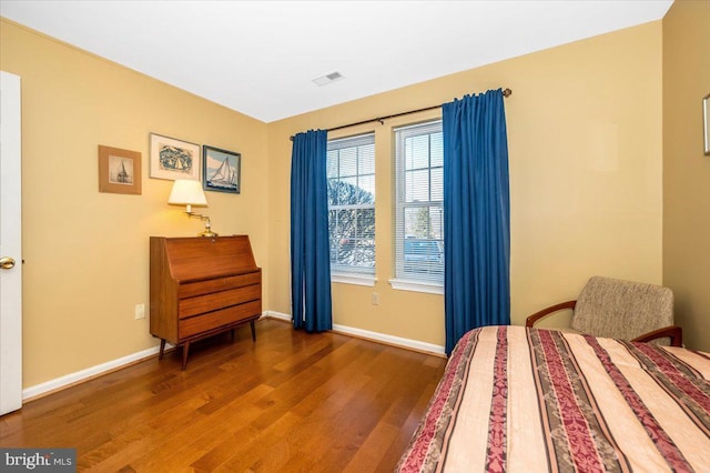 bedroom featuring dark hardwood / wood-style flooring