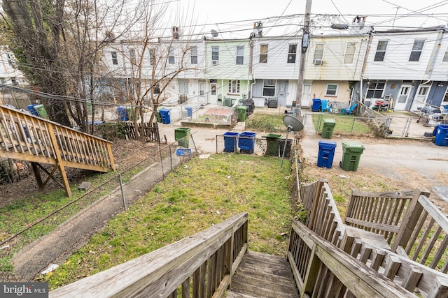 view of yard with a residential view and fence