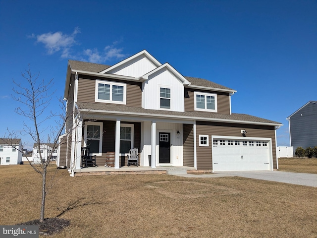 view of front of house with a garage, covered porch, and a front lawn