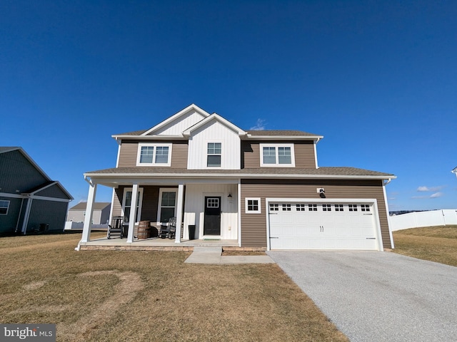 view of front of property with a front yard and covered porch