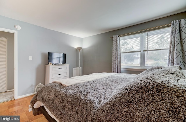 bedroom featuring baseboards