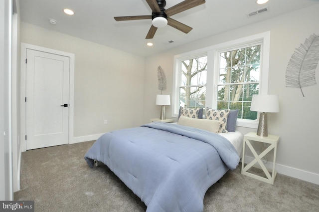 bedroom with light colored carpet, visible vents, baseboards, and recessed lighting