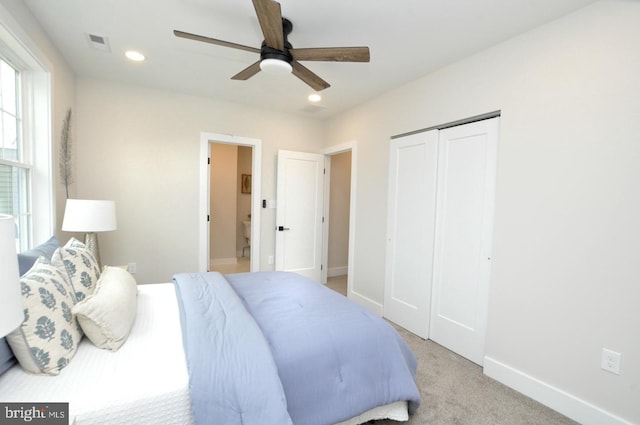 bedroom featuring recessed lighting, a closet, visible vents, light carpet, and baseboards