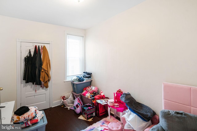 playroom featuring dark wood finished floors