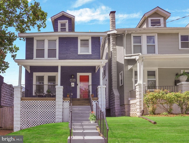 view of front of property featuring a porch and a front lawn