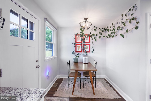 dining room featuring an inviting chandelier and wood-type flooring