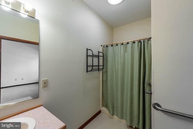 bathroom with vanity and curtained shower