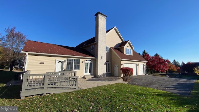 exterior space featuring a garage and a front yard