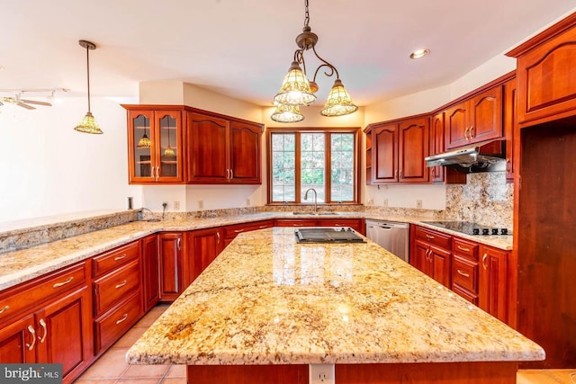 kitchen with hanging light fixtures, a kitchen island, light stone countertops, stainless steel dishwasher, and black electric stovetop