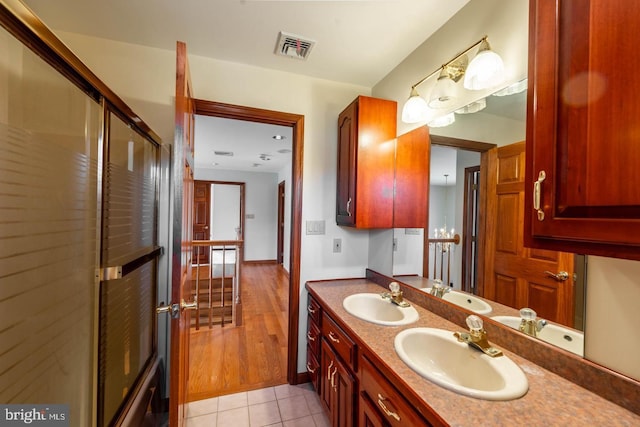 bathroom with tile patterned floors and vanity