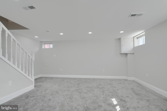 basement featuring a wealth of natural light, recessed lighting, visible vents, and baseboards