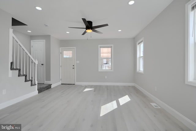 foyer featuring recessed lighting, stairway, light wood-style flooring, a ceiling fan, and baseboards