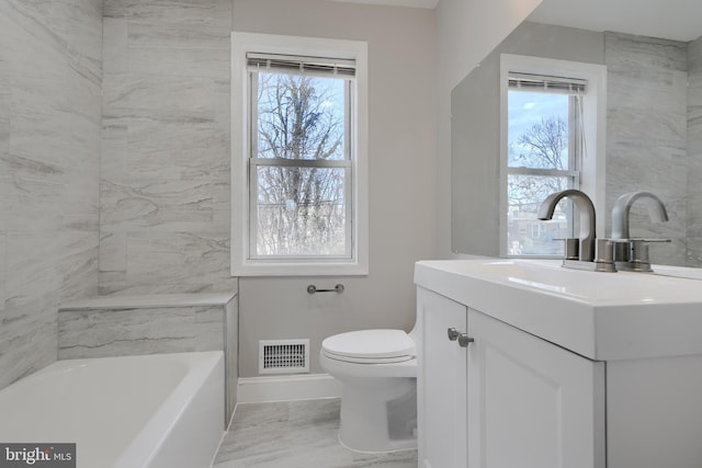 bathroom with a tub to relax in, toilet, vanity, visible vents, and marble finish floor