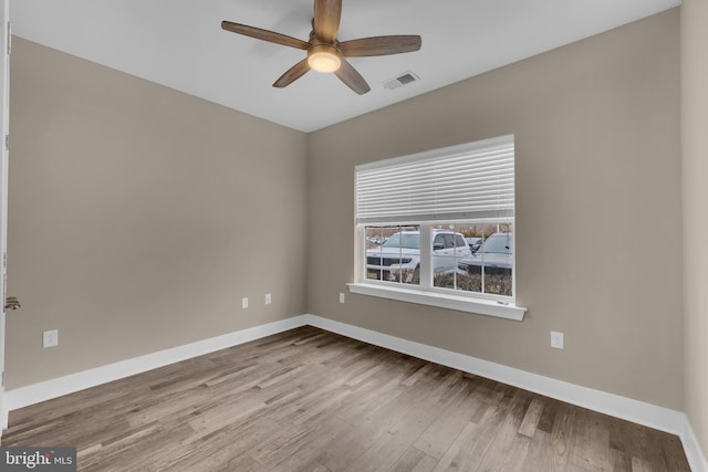 spare room featuring ceiling fan and light wood-type flooring