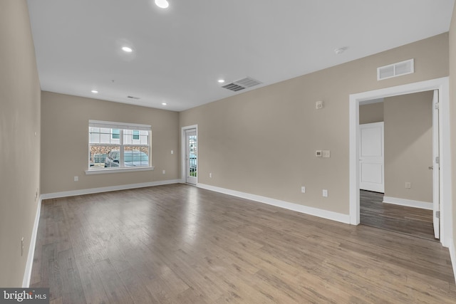 spare room with light hardwood / wood-style floors