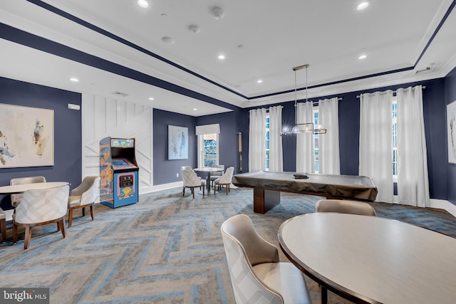 game room with crown molding, a healthy amount of sunlight, carpet flooring, and a raised ceiling