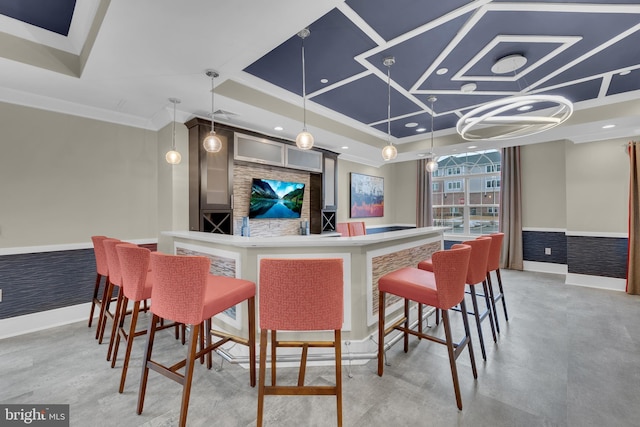 bar featuring ornamental molding and decorative light fixtures