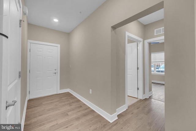 hallway with light wood-type flooring