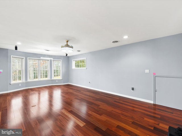 empty room featuring wood-type flooring