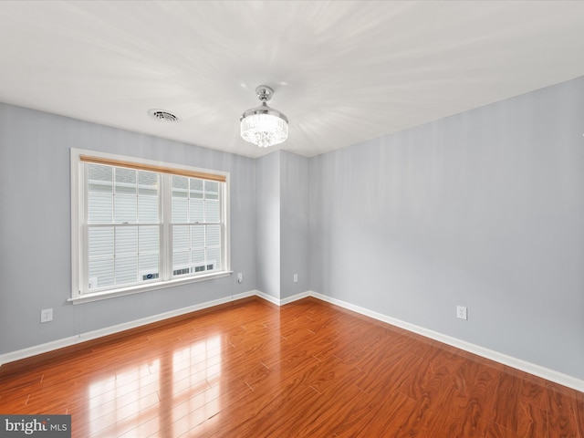 spare room featuring hardwood / wood-style floors