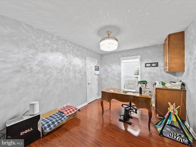 office space featuring hardwood / wood-style floors and an inviting chandelier