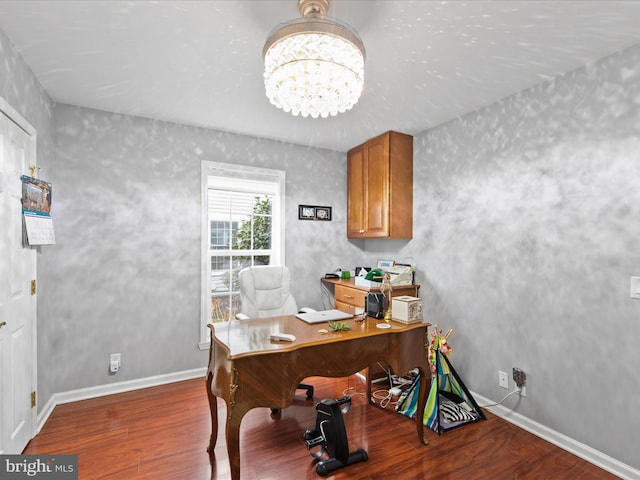 office featuring dark hardwood / wood-style floors and an inviting chandelier