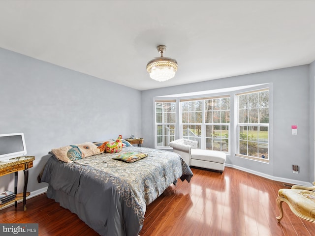 bedroom with hardwood / wood-style floors