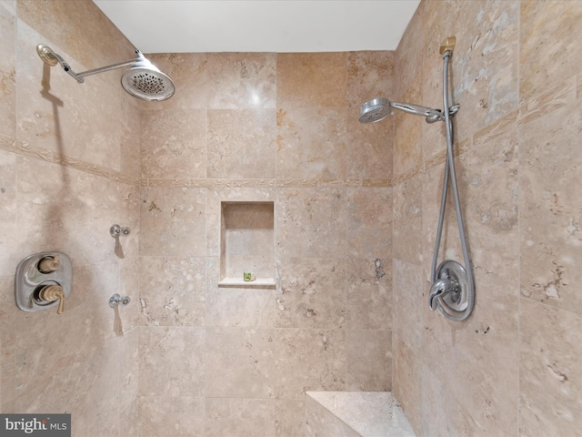 bathroom featuring tiled shower