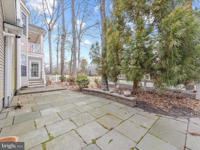 view of patio / terrace with a balcony