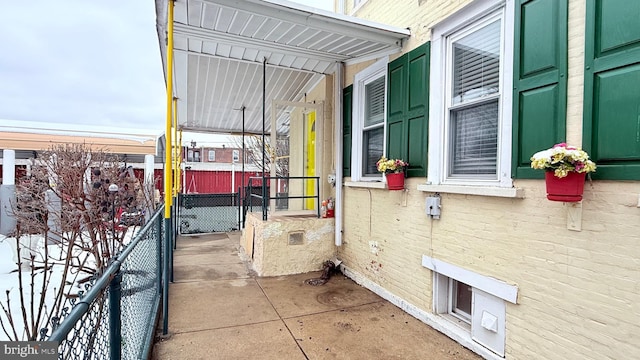 view of side of property featuring brick siding