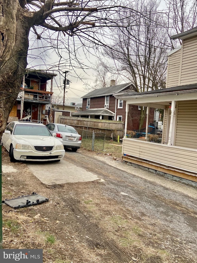 exterior space with fence and driveway