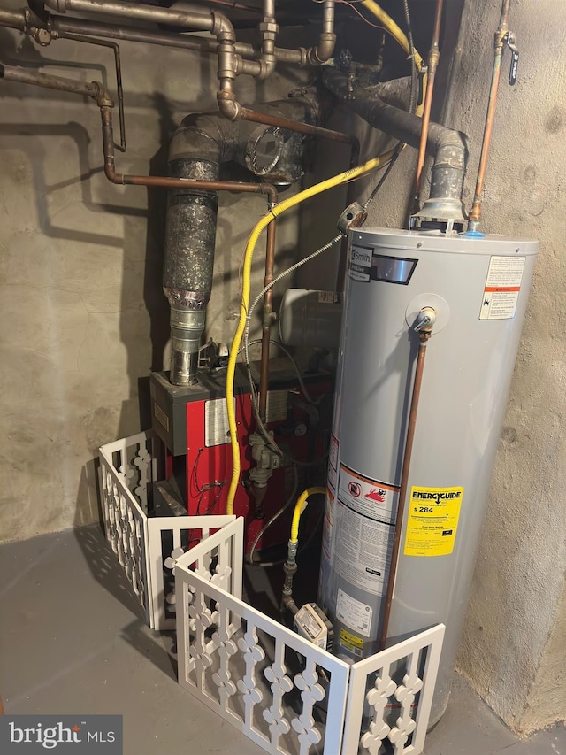 utility room featuring gas water heater