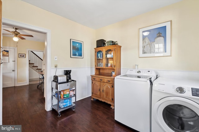 laundry room featuring ceiling fan, washing machine and dryer, and dark wood-type flooring