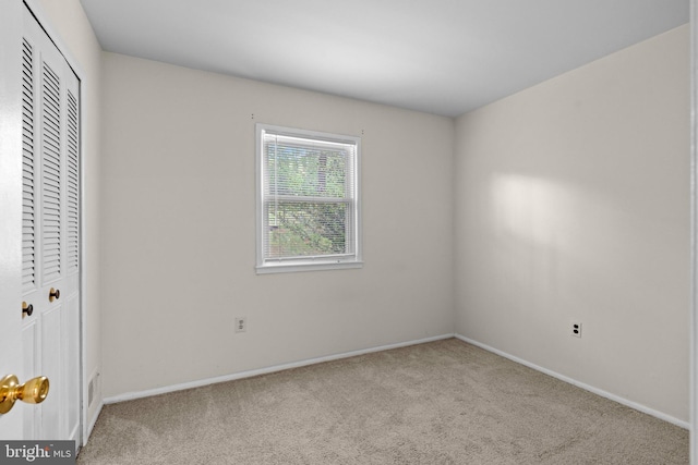 9112 Old Burton Cir, Upper Marlboro, MD 20772 - unfurnished bedroom featuring carpet flooring, baseboards, and a closet