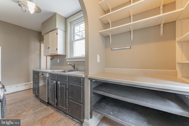 kitchen with open shelves, arched walkways, a sink, light countertops, and dishwasher