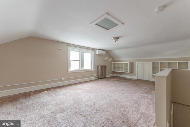 bonus room with radiator, baseboards, vaulted ceiling, a wall mounted air conditioner, and carpet flooring