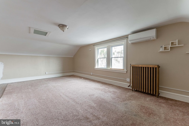 additional living space featuring carpet flooring, a wall mounted air conditioner, radiator heating unit, and lofted ceiling