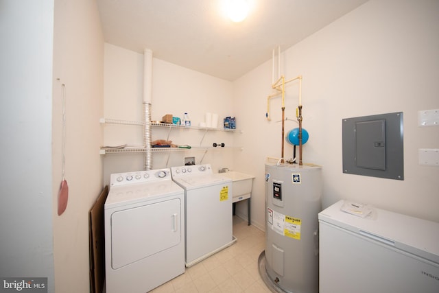 laundry room with laundry area, electric water heater, electric panel, and separate washer and dryer