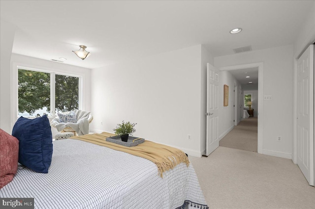 carpeted bedroom with baseboards, visible vents, and recessed lighting