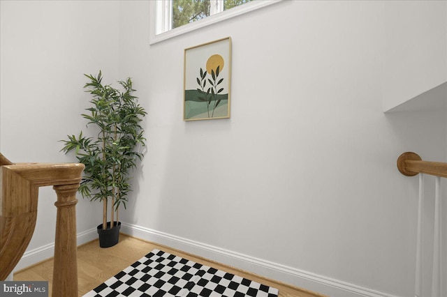 interior details with baseboards and wood finished floors