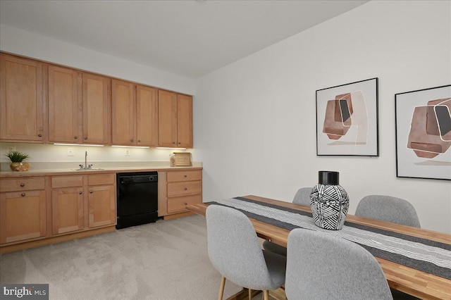 kitchen with a sink, light countertops, dishwasher, and light colored carpet