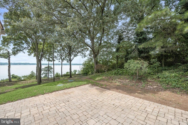 view of patio with a water view