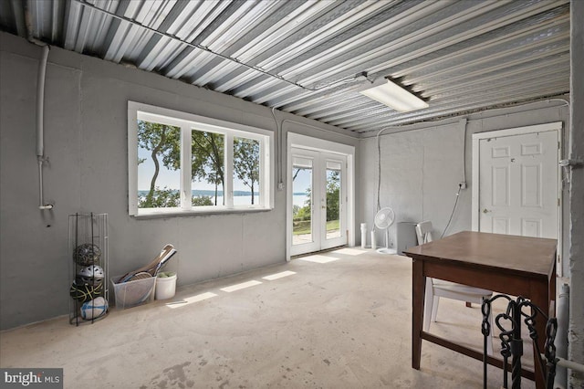 misc room featuring french doors and concrete floors