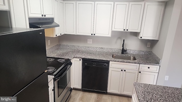 kitchen featuring black appliances, a sink, white cabinets, and under cabinet range hood