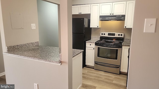 kitchen featuring stainless steel range with electric stovetop, white cabinetry, and ventilation hood